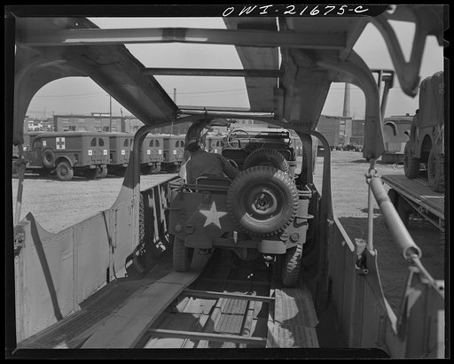 Detroit, Michigan. Loading a jeep on a haulaway truck