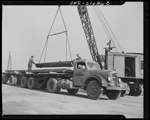 Detroit, Michigan. Loading steel bars on a truck