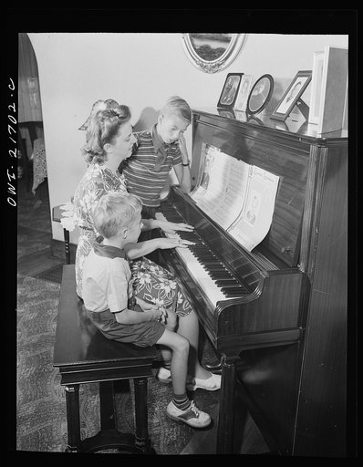 Rochester, New York. Howard and Earl Babcock enjoy singing to their mother's piano accompaniment