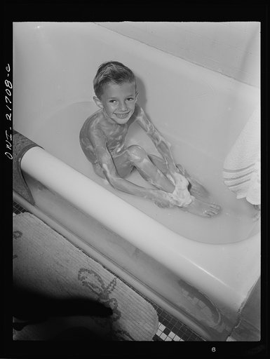 Untitled photo, possibly related to: Rochester, New York. Earl Babcock enjoying his daily bath