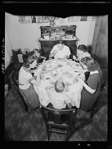 Untitled photo, possibly related to: Rochester, New York. The Babcocks at the dinner table