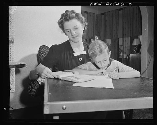 Rochester, New York. Shirley Babcock helping her brother Earl with his lessons