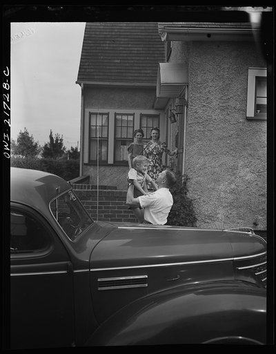 Rochester, New York. Mrs. Babcock, Shirley, and Earl greeting Mr. Babcock in front of the house