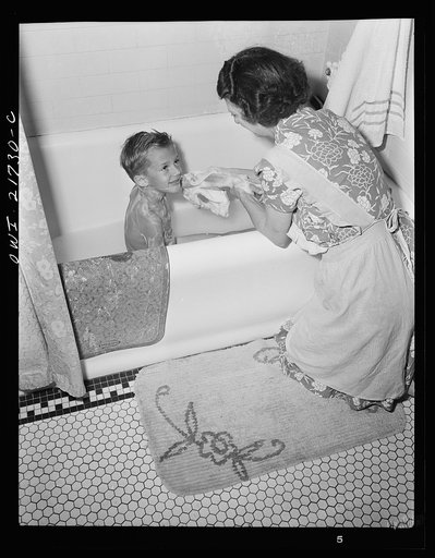 Rochester, New York. Earl Babcock's mother helping with his bath