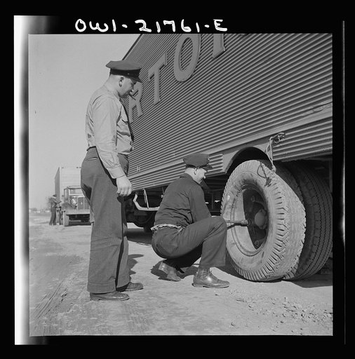 Truck drivers changing a tire along U.S. Highway 29 in North Carolina