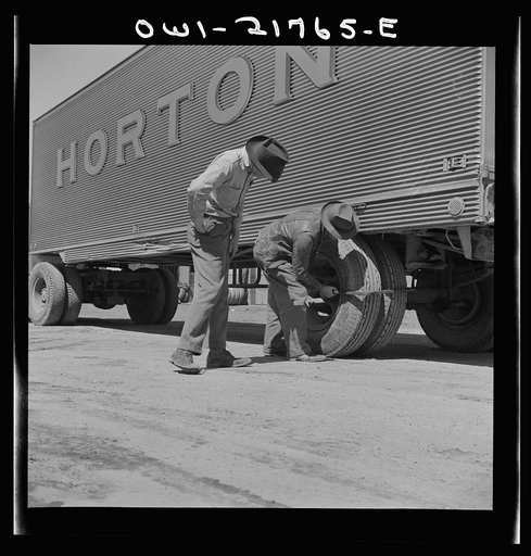 Burlington, North Carolina. Testing the thickness of tires on a trailer at the Associated Transport Company terminal