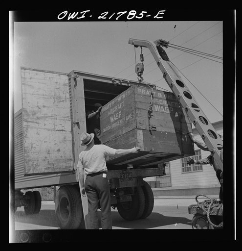 Gunter Field, Alabama. Loading airplane motors onto a truck. They are being shipped to Macon, Georgia for repairs