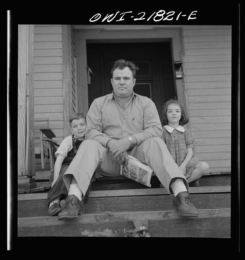 Untitled photo, possibly related to: Montgomery, Alabama. Marvin Johnson, truck driver, with his two children
