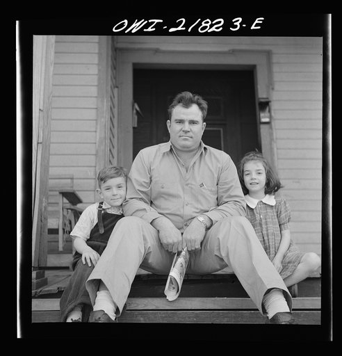 Montgomery, Alabama. Marvin Johnson, truck driver, with his two children