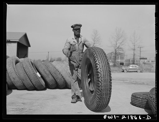 Untitled photo, possibly related to: Charlotte, North Carolina. Loading tires onto a truck at the terminal of the Associated Transport Company for shipment to other terminals