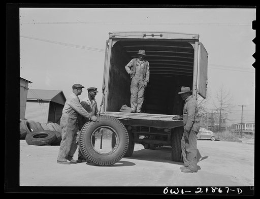 Untitled photo, possibly related to: Charlotte, North Carolina. Loading tires onto a truck at the terminal of the Associated Transport Company for shipment to other terminals