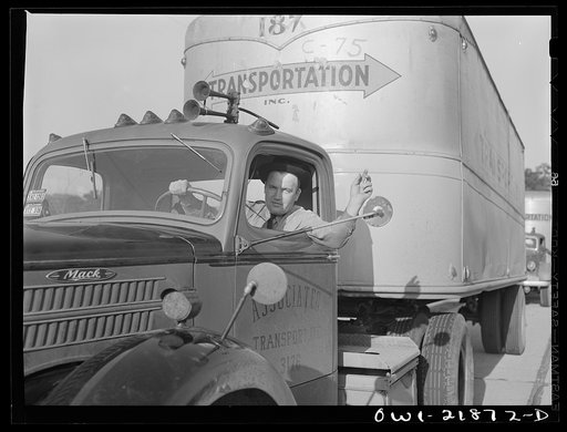 Jim Bishop waving to a passing truck driver on U.S. Highway 29 in Georgia