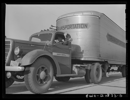 Joe Crow waving to a passing truck driver on U.S. Highway 29 in Georgia