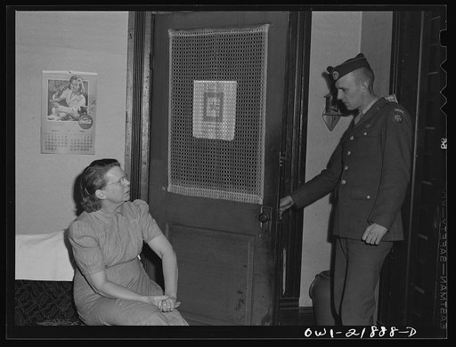 Untitled photo, possibly related to: Montgomery, Alabama. Mrs. Brannon talking with a soldier stationed at the same camp as her son