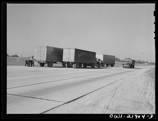Untitled photo, possibly related to: Truck drivers changing a tire along U.S. Highway 29 enroute to Charlotte, North Carolina