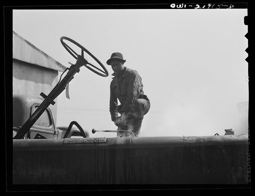 Untitled photo, possibly related to: Charlotte, North Carolina. Steam cleaning a truck chassis which has been overhauled at the Brown Equipment Company