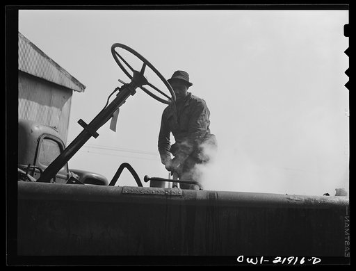 Charlotte, North Carolina. Steam cleaning a truck chassis which has been overhauled at the Brown Equipment Company