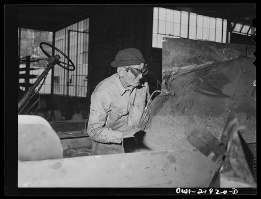 Untitled photo, possibly related to: Charlotte, North Carolina. Welder at work on a truck tractor at the Brown Equipment Company
