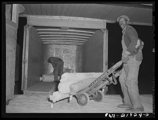Untitled photo, possibly related to: Charlotte, North Carolina. Loading trucks