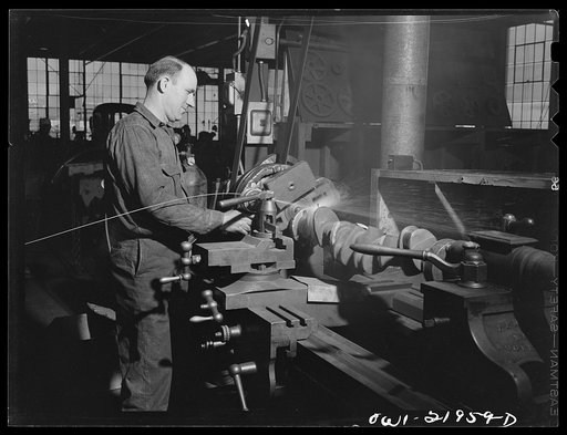 Charlotte, North Carolina. Working on a truck part with metalizing machine at the Brown Equipment Company