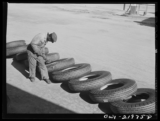 Charlotte, North Carolina. Branding tires with serial numbers at the Associated Transport Company terminal