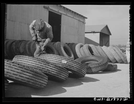 Charlotte, North Carolina. Branding tires with serial numbers at the Associated Transport Company terminal