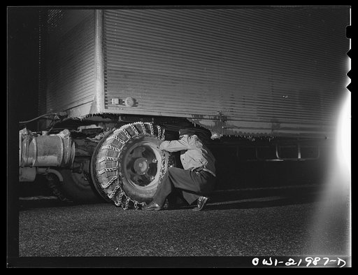 Jim Fletcher putting on chains while crossing mountains in eastern Tennessee
