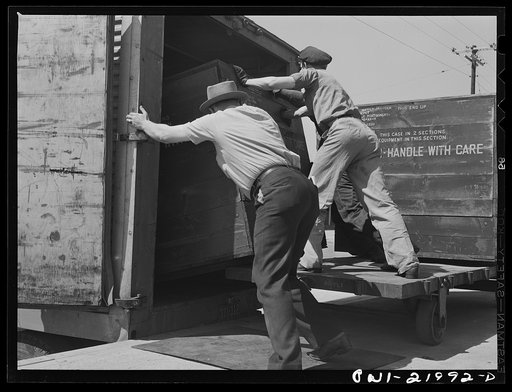 Gunter Field, Alabama. Loading airplane motors onto trucks. They are being shipped to Macon, Georgia for repairs