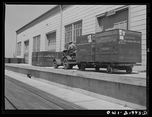 Gunter Field, Alabama. Loading airplane motors onto trucks. They are being shipped to Macon, Georgia for repairs