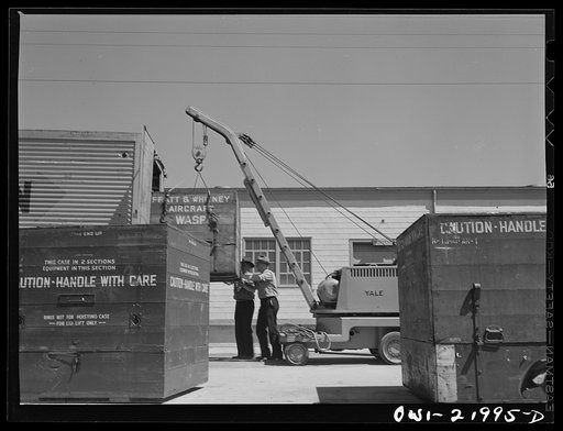 Untitled photo, possibly related to: Gunter Field, Alabama. Loading airplane motors onto trucks. They are being shipped to Macon, Georgia for repairs
