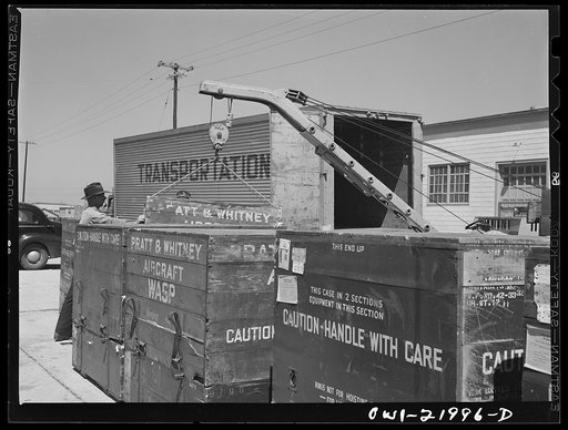 Untitled photo, possibly related to: Gunter Field, Alabama. Loading airplane motors onto trucks. They are being shipped to Macon, Georgia for repairs