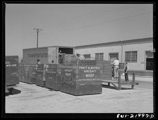 Gunter Field, Alabama. Loading airplane motors onto trucks. They are being shipped to Macon, Georgia for repairs