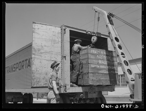 Gunter Field, Alabama. Loading airplane motors onto trucks. They are being shipped to Macon, Georgia for repairs