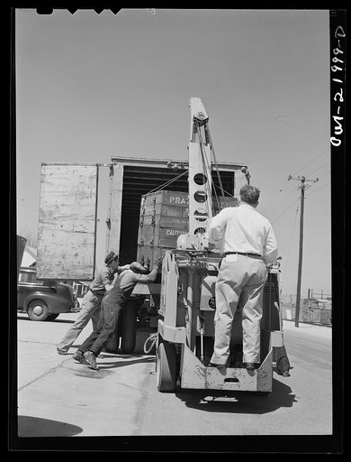 Gunter Field, Alabama. Loading airplane motors onto trucks. They are being shipped to Macon, Georgia for repairs
