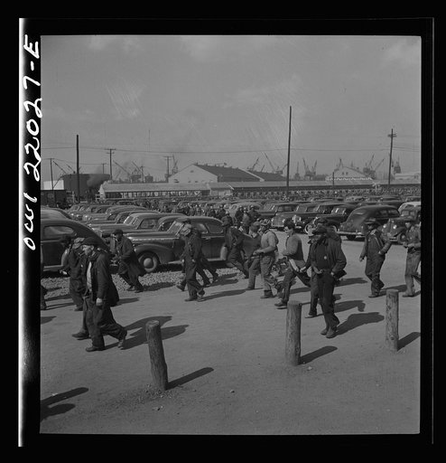 Untitled photo, possibly related to: Baltimore, Maryland. Workers on the second shift who leave the Bethlehem Fairfield shipyard at three p.m. to get trolleys and automobiles
