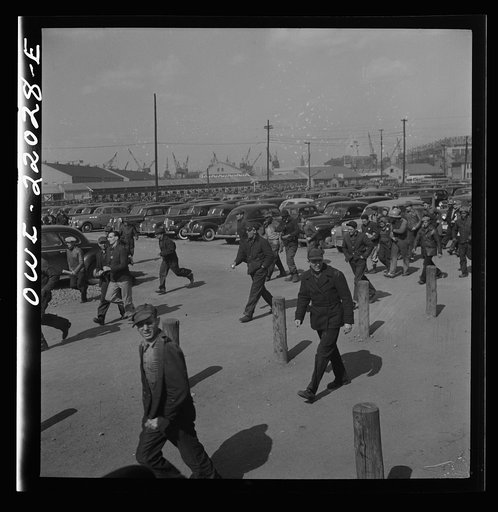 Baltimore, Maryland. Workers on the second shift who leave the Bethlehem Fairfield shipyard at three p.m. to get trolleys and automobiles