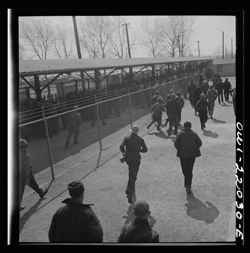 Untitled photo, possibly related to: Baltimore, Maryland. Workers on the second shift who leave the Bethlehem Fairfield shipyard at three p.m. to get trolleys and automobiles