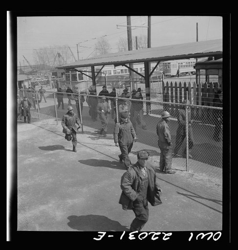Untitled photo, possibly related to: Baltimore, Maryland. Workers on the second shift who leave the Bethlehem Fairfield shipyard at three p.m. to get trolleys and automobiles