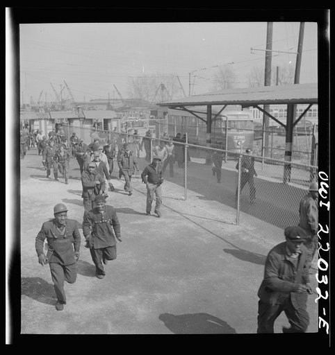 Untitled photo, possibly related to: Baltimore, Maryland. Workers on the second shift who leave the Bethlehem Fairfield shipyard at three p.m. to get trolleys and automobiles