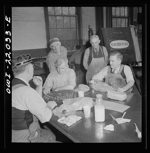 Baltimore, Maryland. Employees of the paint shop playing checkers during lunch at the Washington terminal of the Baltimore Transit Company where trolleys and buses are maintained and repaired. Employees who work on trolleys are noticeably older than those on buses because trolleys have been in exist