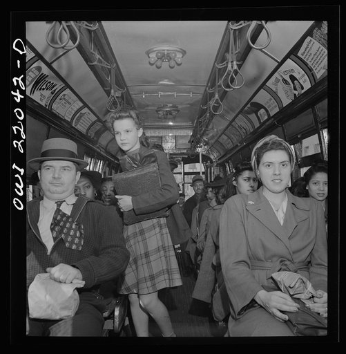 Baltimore, Maryland. School children and workers returning home on a trolley at five p.m.