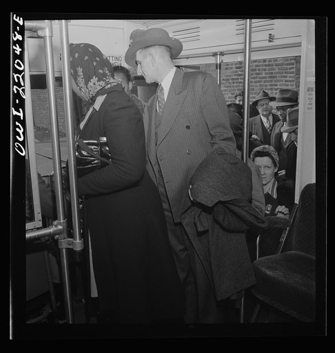 Baltimore, Maryland. Workers returning home at four p.m. crowding onto a bus