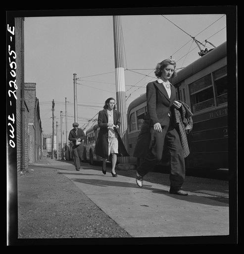 Baltimore, Maryland. Rushing to catch the trackless trolleys home from work at four p.m.