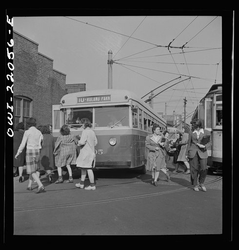 Baltimore, Maryland. Rushing to catch the trackless trolleys home from work at four PM