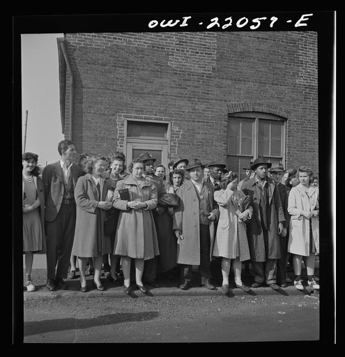 Baltimore, Maryland. Waiting for a bus at a busy intersection at four p.m.
