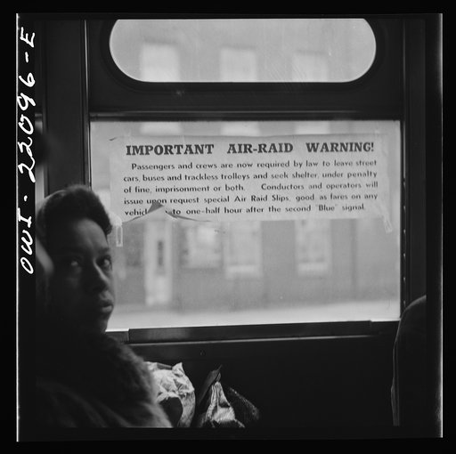 Untitled photo, possibly related to: Baltimore, Maryland. Air raid notice on a bus window