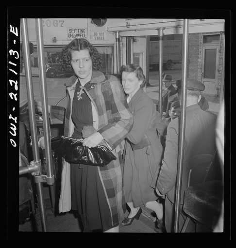 Baltimore, Maryland. Crowding onto a bus at four p.m.