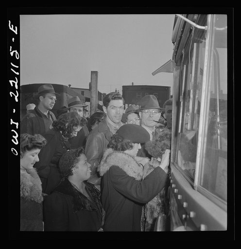 Baltimore, Maryland. Crowding onto a bus at four p.m.