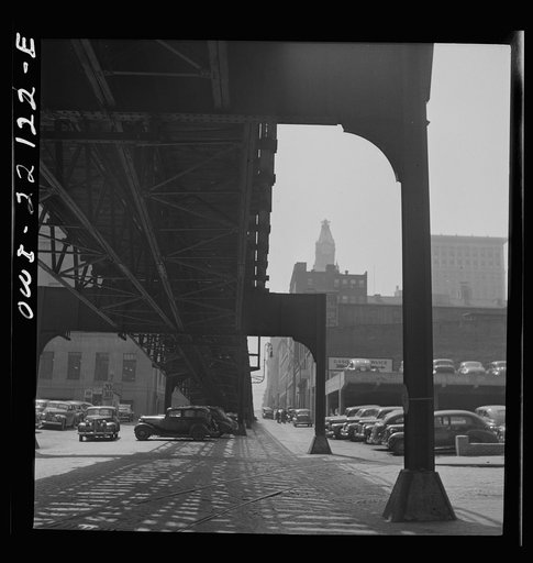 Baltimore, Maryland. Under the elevated trolley. The Baltimore Trust building is in the distance