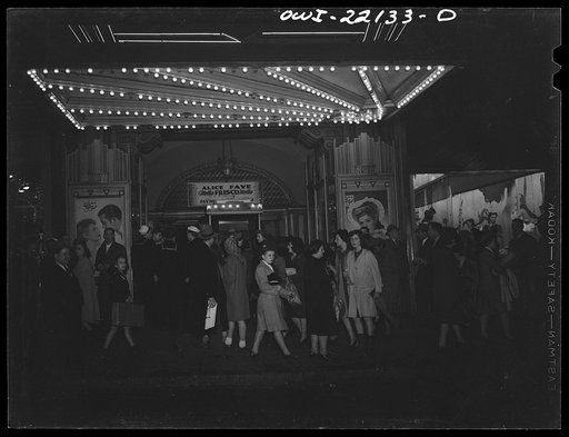 Baltimore, Maryland. Thursday night shoppers in a line outside a movie theatre